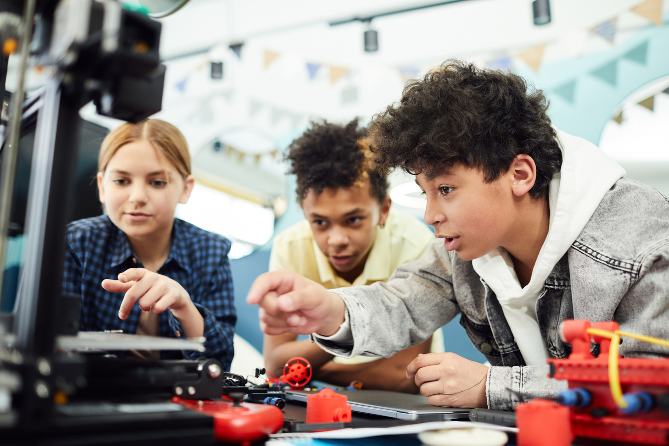 Diverse friends creating project together